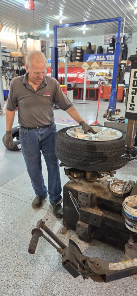 Joe working on a tire mounting machine